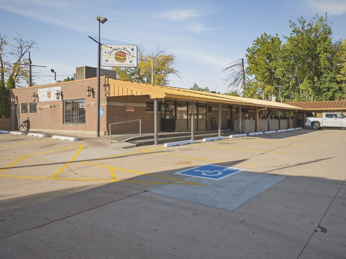 The Starlite Room, a brick bar and grill with a gold roofline and a star-covered burger sign